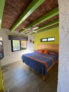a bedroom with a bed in a room at Lofts Las Cuatro Puertas in Guanajuato