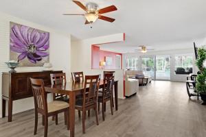 a dining room and living room with a table and chairs at Anna Maria's Finest in Anna Maria