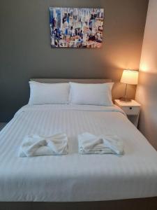Postel nebo postele na pokoji v ubytování The Viera Chiangrai