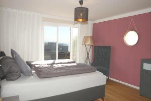 Postel nebo postele na pokoji v ubytování Haus Bregenz Apartment Bodensee