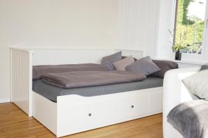 Postel nebo postele na pokoji v ubytování Haus Bregenz Apartment Bodensee