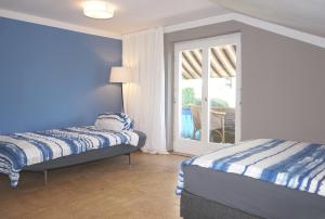 Postel nebo postele na pokoji v ubytování Haus Bregenz Apartment Bodensee