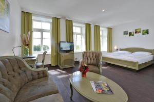 TV a/nebo společenská místnost v ubytování Hotel Stadt Hameln