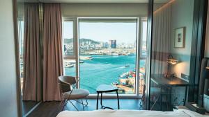a hotel room with a view of the ocean at Lavalse Hotel in Busan