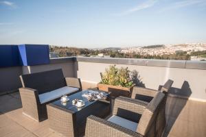 a patio with chairs and a table on a balcony at Holiday Inn Express Istanbul-Altunizade, an IHG Hotel in Istanbul