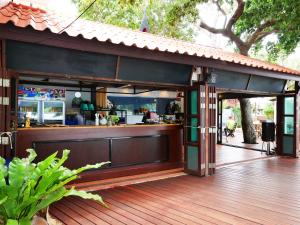 a bar on the deck of a restaurant at Vimarn Samed Resort in Ko Samed