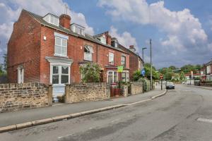 a brick building on the side of a street at Refurbished Plush Property Great Transport Links in Sheffield