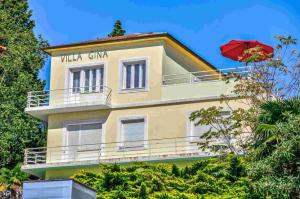 a yellow building with a sign that reads what city at Apartment in Crikvenica 14104 in Sopaljska