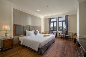 Postel nebo postele na pokoji v ubytování AVS Hotel Phu Quoc