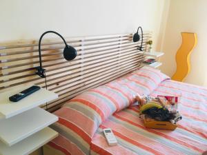 Posteľ alebo postele v izbe v ubytovaní La Terrazza Sul Mar Mediterraneo