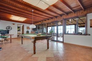 a living room with a pool table in it at Pure La Asomada in La Asomada