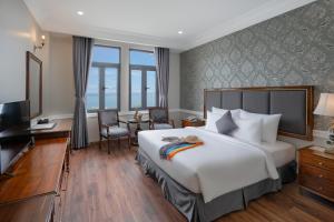 Postel nebo postele na pokoji v ubytování AVS Hotel Phu Quoc