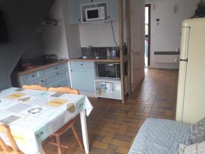 Cuisine ou kitchenette dans l'établissement Cottage à Merlimont plage