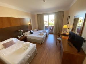 Postel nebo postele na pokoji v ubytování Hotel Montera Plaza
