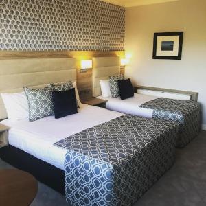 Voodi või voodid majutusasutuse Kiltimagh Park Hotel toas
