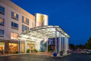 a building with a glass canopy in front of it at Hotel Indigo Columbus Architectural Center, an IHG Hotel in Columbus