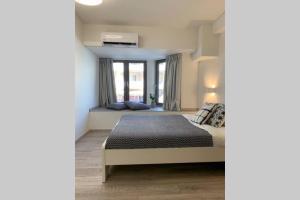 A bed or beds in a room at Aelia Luxury Beach House