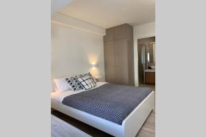 A bed or beds in a room at Aelia Luxury Beach House