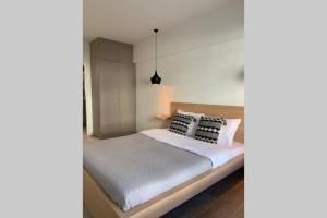 A bed or beds in a room at Aelia Luxury Beach House