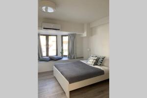 A bed or beds in a room at Aelia Luxury Beach House