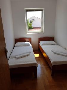 Postel nebo postele na pokoji v ubytování Apartment Malinska, Primorje-Gorski Kotar 19
