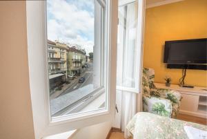 a room with a window with a view of a street at Apartments Villa Devana 2 in Opatija