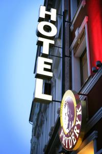 a hotel sign on the side of a building at Hotel Fryderyk in Nysa