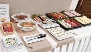 a buffet of food on top of a table at Vector-Property in Tarnowo Podgórne