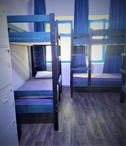 
a row of bunk beds in a room at Tapok Hostel in Chişinău
