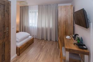 מיטה או מיטות בחדר ב-Hotel Naturum