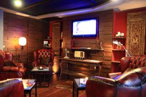 TV a/nebo společenská místnost v ubytování The Fusion Suites