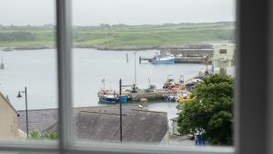 a view of a harbor with boats in the water at Castleplace Apartment in Ardglass