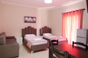 A bed or beds in a room at Villa Kela