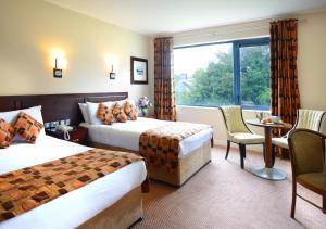 Voodi või voodid majutusasutuse Kiltimagh Park Hotel toas