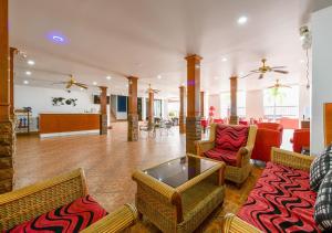 a living room with chairs and a table and a lobby at Sun & Beach in Pattaya South