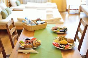 a table with three plates of food on it at WenderEDU Business Center in Wrocław