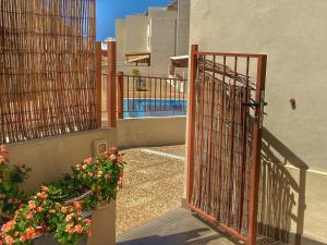 an open gate to a house with a pool at Los Cristianos 4 Bed Townhouse in Los Cristianos
