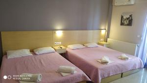 Posteľ alebo postele v izbe v ubytovaní Oniro Rooms & Suites