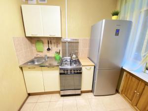 A cozinha ou cozinha compacta de Apartment Ibragimova 25