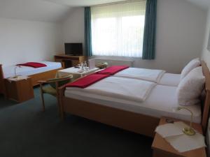 Un pat sau paturi într-o cameră la Gästehaus Spieker