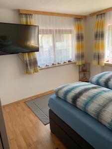 A bed or beds in a room at Landhaus Viktoria