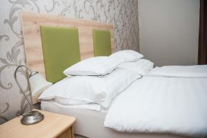 Posteľ alebo postele v izbe v ubytovaní Hozam Wellness és Apartman