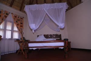 Кровать или кровати в номере Acaki Lodge