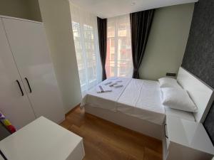 Postel nebo postele na pokoji v ubytování LONDON OTEL