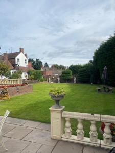 a balcony with a vase of flowers on a fence at Parlors Hall Hotel in Bridgnorth