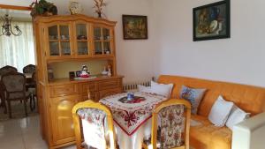 a living room with a couch and a table at Сара in Gabrovo