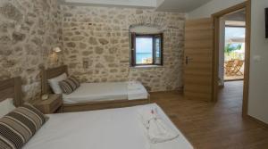 Postel nebo postele na pokoji v ubytování Abraham Apartments