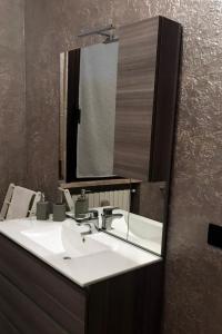 a bathroom with a sink and a mirror at casa TRE19 in Mantova +29 photos