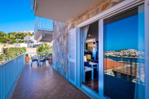 a balcony with a view of the ocean at Villa Gaga in Dubrovnik
