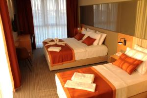 מיטה או מיטות בחדר ב-YURDAKUL HOTEL
